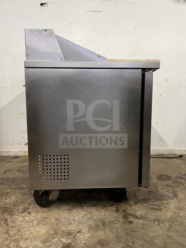 True TSSU-48-12-HC stainless steel sandwich salad prep unit, holds 12 1/6 pans, used condition, side view.
