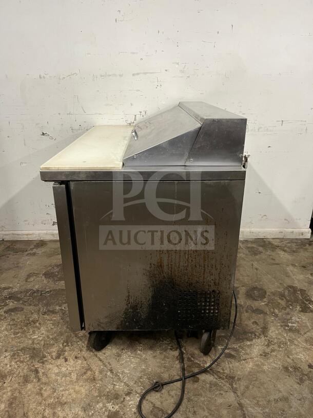 True TSSU-48-12-HC stainless sandwich salad prep unit, holds twelve 1/6 pans, visible wear on exterior.