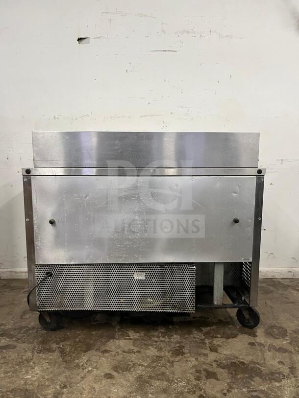 True TSSU-48-12-HC stainless steel sandwich salad prep unit, holds 12 1/6 pans, on wheels, used condition.