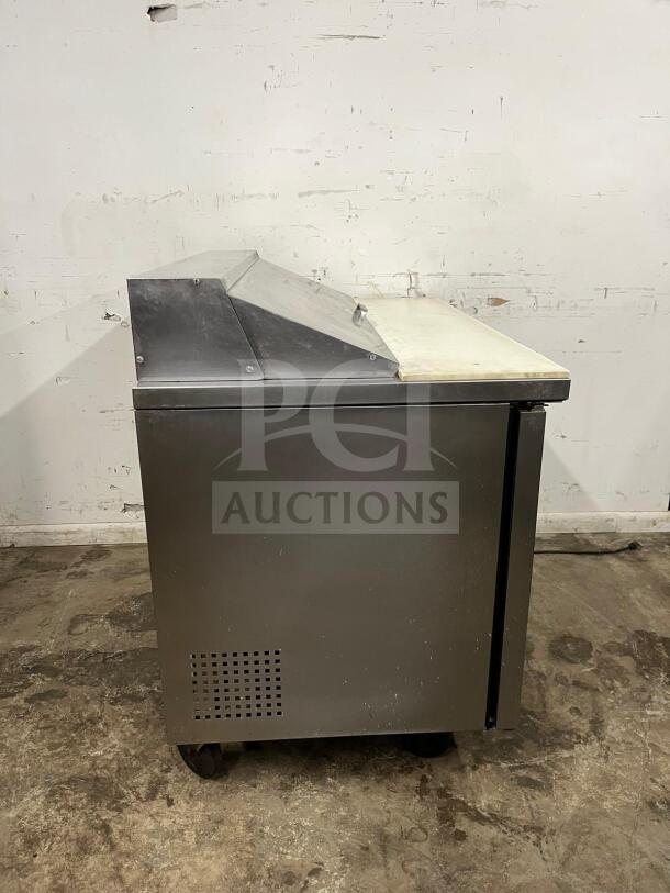 True TSSU-48-12-HC stainless prep unit in used condition, holds twelve 1/6 pans, features durable top and side vents.