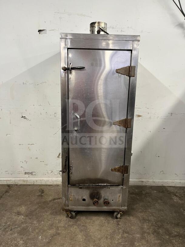 Universal Smoker Oven, stainless steel, galvanized interior, 3 burners, 78", visible rust, on wheels, commercial use.