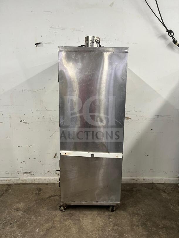 Universal smoker oven, stainless steel, galvanized interior, 3 burners, 78" tall, on casters, fair condition.