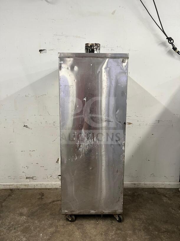 Universal Smoker Stainless Steel Oven, 78" height, galvanized interior, 3 burners, worn condition, on wheels.