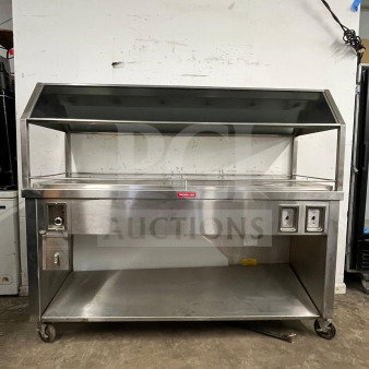 Stainless steel Gaylord hot food steam buffet table in excellent condition, model buffet table, features shelving and heating controls.