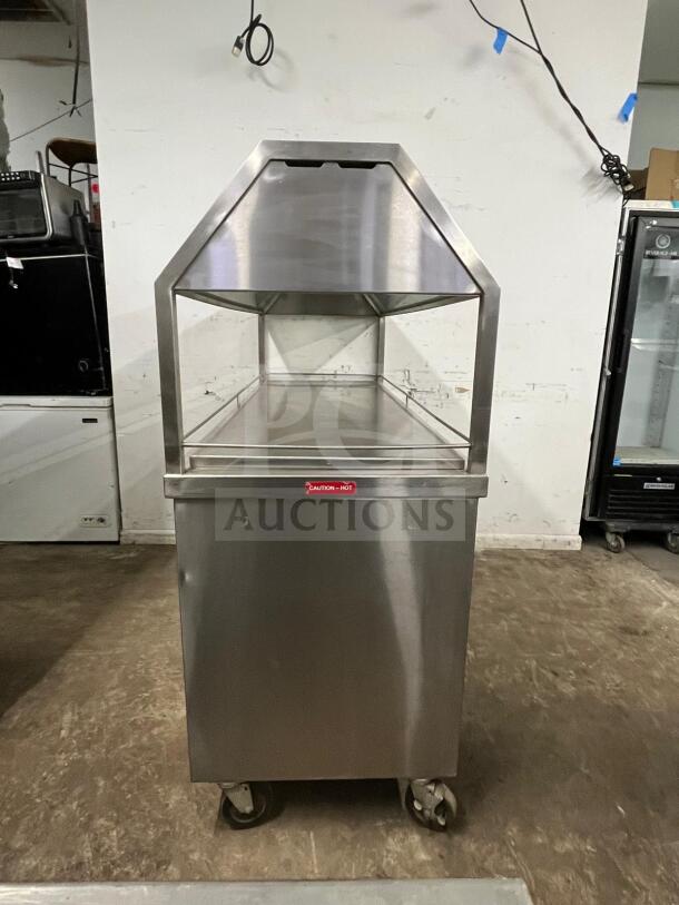 Stainless steel Gaylord hot food steam buffet table in amazing condition with caster wheels and "Caution - Hot" label.