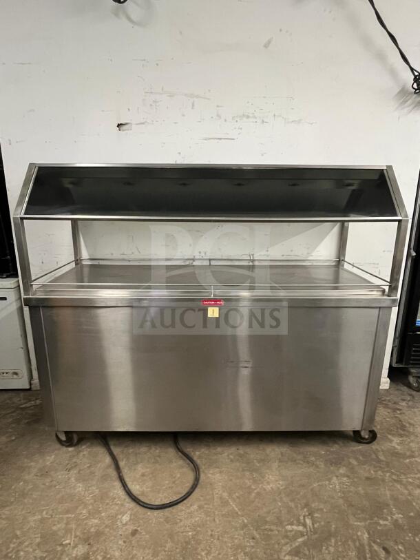 Gaylord stainless steel steam buffet table in amazing condition, featuring a protective cover and sturdy construction for hot food display.