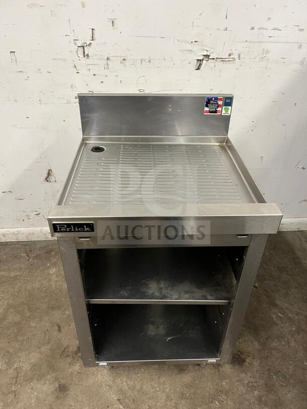 Perlick SC24-18 storage cabinet with open base, shelves, and stainless steel finish. Includes visible brand label and condition use marks.