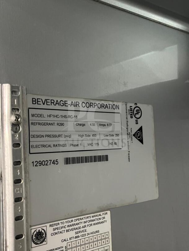 Beverage-Air HF1HC-1HS Horizon Series 26" top-mounted half solid door reach-in freezer, model info and specs label visible.