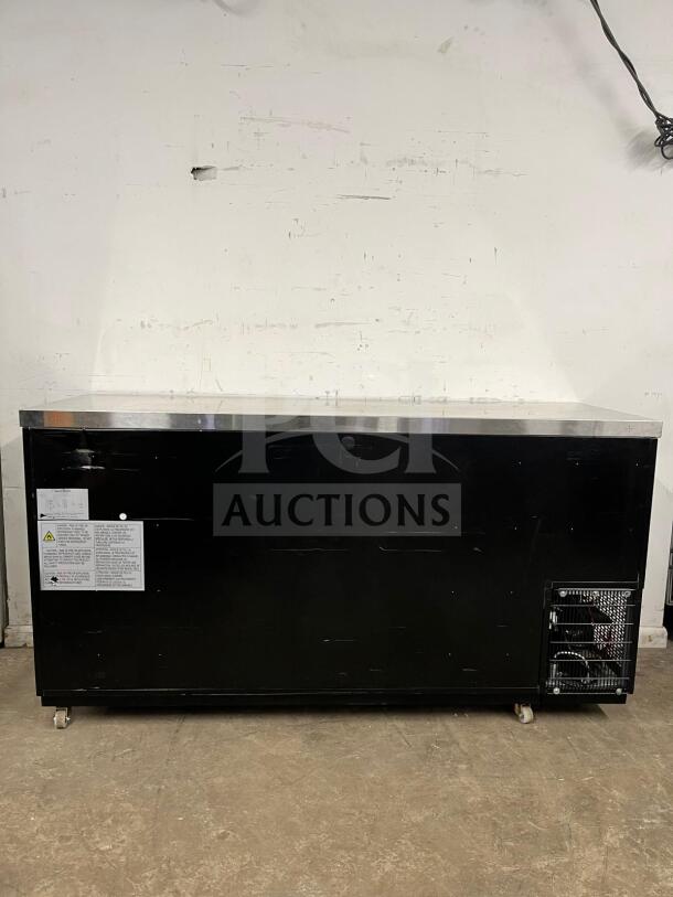 Dukers Back Bar Beverage Cooler DBB72, black exterior, visible labels with safety and operation instructions, on casters.