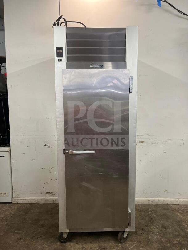 Traulsen G10010 30" reach-in refrigerator with solid right-hinged door, stainless steel, mounted on casters, in good condition.