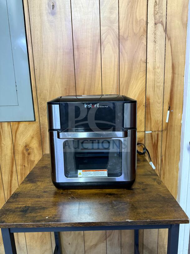 Instant Pot Vortex Plus 10 Quart Air Fryer Oven. Black, stainless steel finish, 10-in-1 model. Visible brand logo.