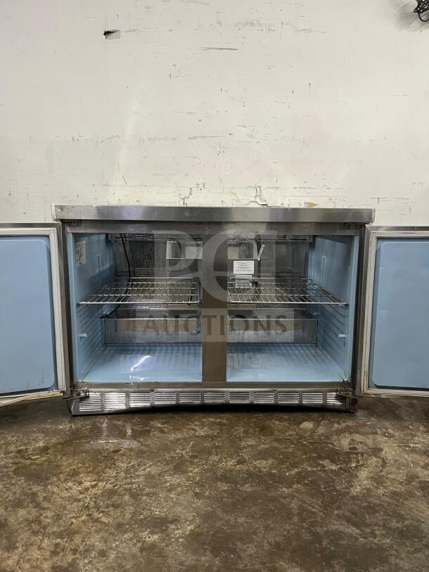 Delfield 4448NP-18M 48" refrigerated prep table, stainless steel, visible shelving, dual doors open, commercial use.