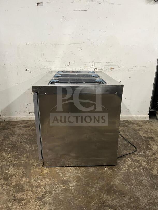 Delfield 4448NP-18M 48" refrigerated salad prep table with 18 pans, stainless steel, fair condition, minor wear visible.