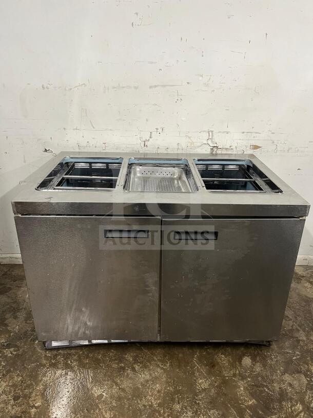 Delfield 4448NP-18M 48" refrigerated mega top salad prep table with 18 pans, stainless steel finish, used condition.