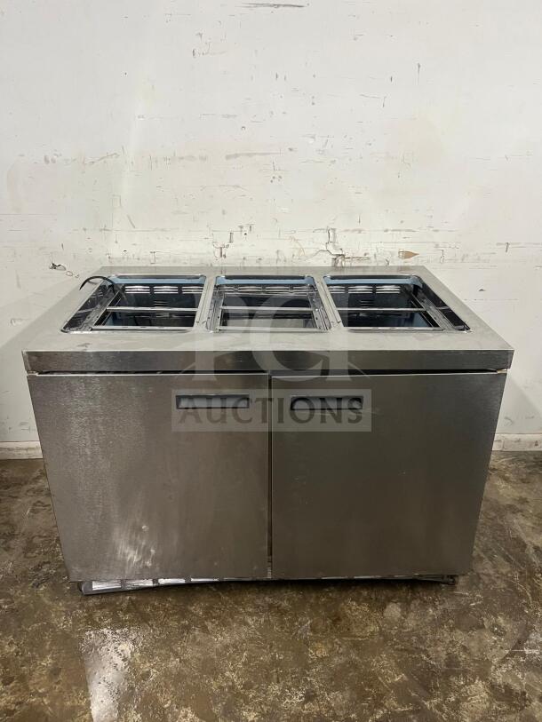 Delfield 4448NP-18M 48" refrigerated salad prep table, stainless steel, space for 18 pans, good condition.