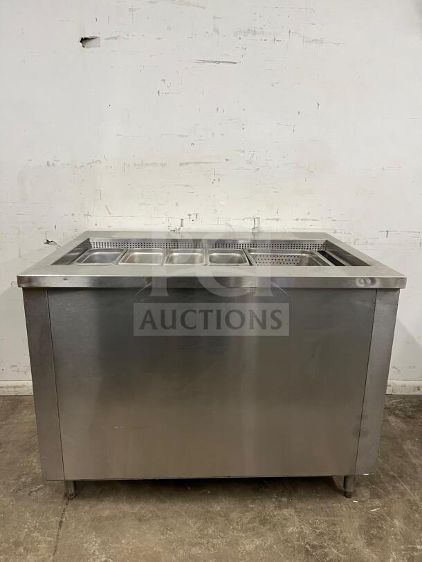 Stainless steel prep table with salad bar, featuring multiple compartments; in excellent condition.