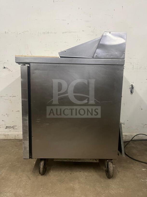 True TSSU-27-08-HC refrigerated sandwich prep table, stainless steel, right hinged door, wheeled base, used condition.
