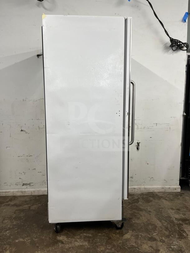Arctic Air F22CWF 22 Cu.Ft commercial freezer, solid door, NSF-certified, white exterior, side view with casters.