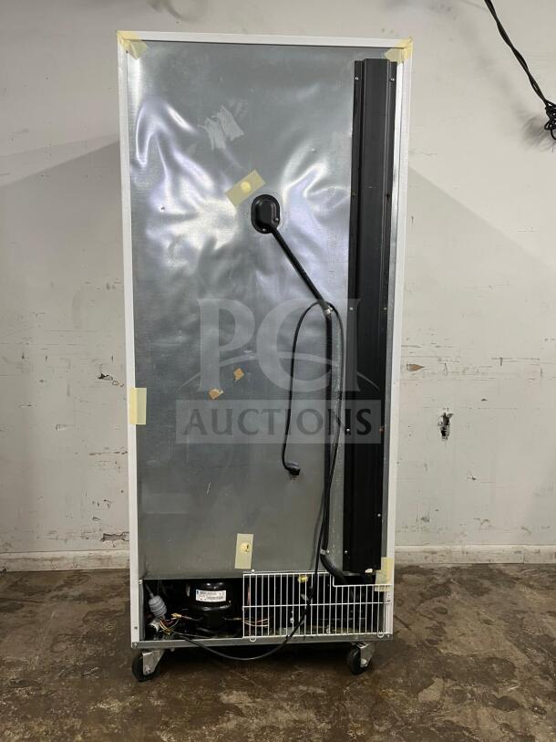 Arctic Air F22CWF 22 Cu.Ft Commercial Reach In Freezer with solid door, NSF certified; shows wear on surface, on casters.