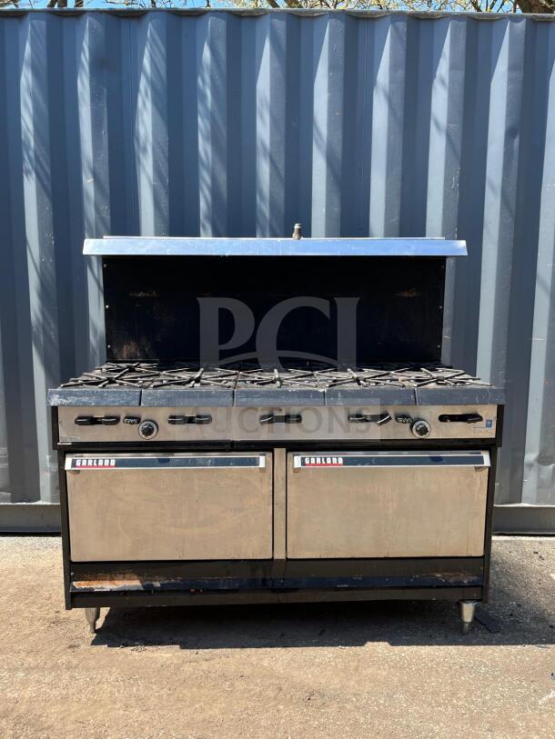 Garland Natural Gas 10 Burner Range, 60" with Two Ovens, 406,000 BTU, visible branding, outdoor setting, used condition.