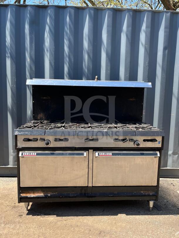 Garland Natural Gas 10 Burner 60" Range with two ovens, 406,000 BTU, stainless steel, model visible, good condition.