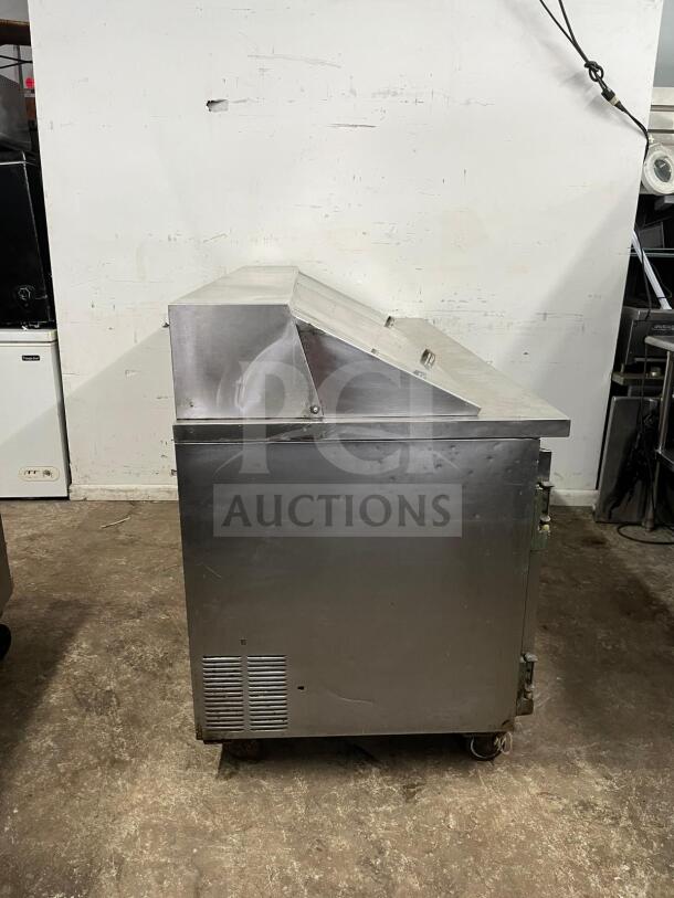LEADER NSFM72 72" 3-door refrigerated prep table, stainless steel, used condition, features bain marie top for salads.