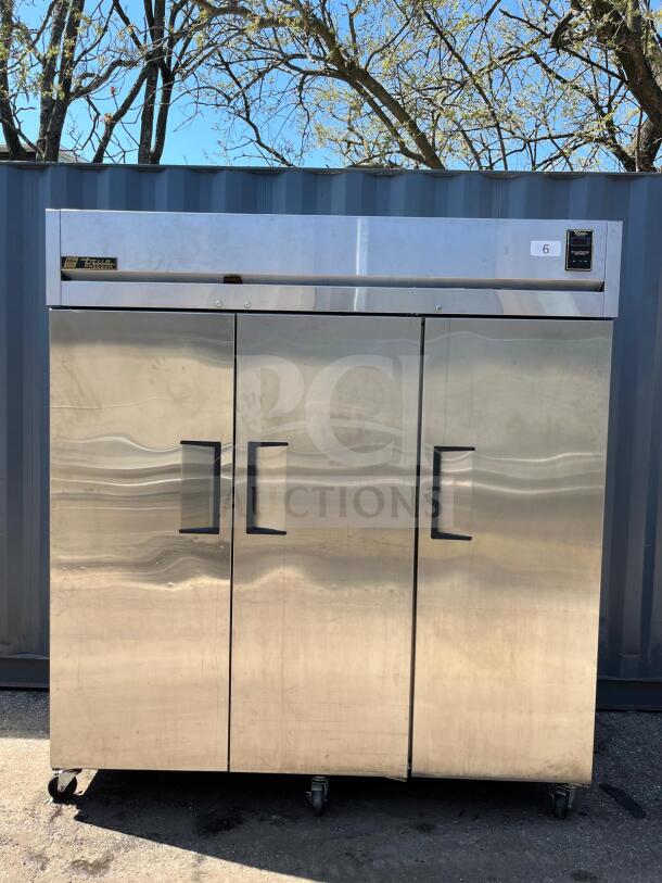 True TR3F-3S-HC Spec Series 77 3/4" solid door reach-in freezer. Stainless steel, three doors, model TE3F-3S, on casters.