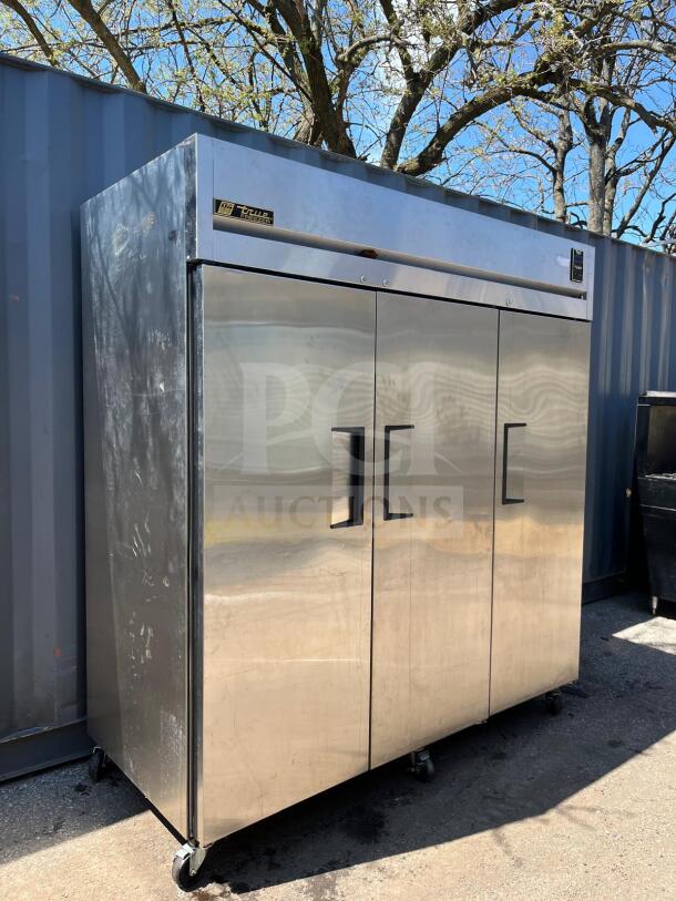 TRUE TR3F-3S-HC Spec Series reach-in freezer, 77 3/4", three solid doors, stainless steel, on casters, used condition.