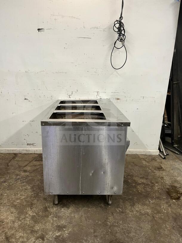 RANDELL 3513-120 48" electric hot food table with three top openings, stainless steel, visible wear, electric cord attached.