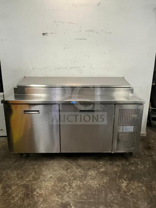 RANDELL 8268N 68" refrigerated pizza prep table, two doors, silver, 17.76 cu. ft., clean condition, on wheels.