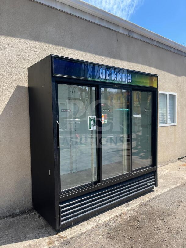 TRUE GDM-69 glass door merchandiser with three sliding doors, black, labeled "Cold Beverages," 78 1/8" wide, 115v.