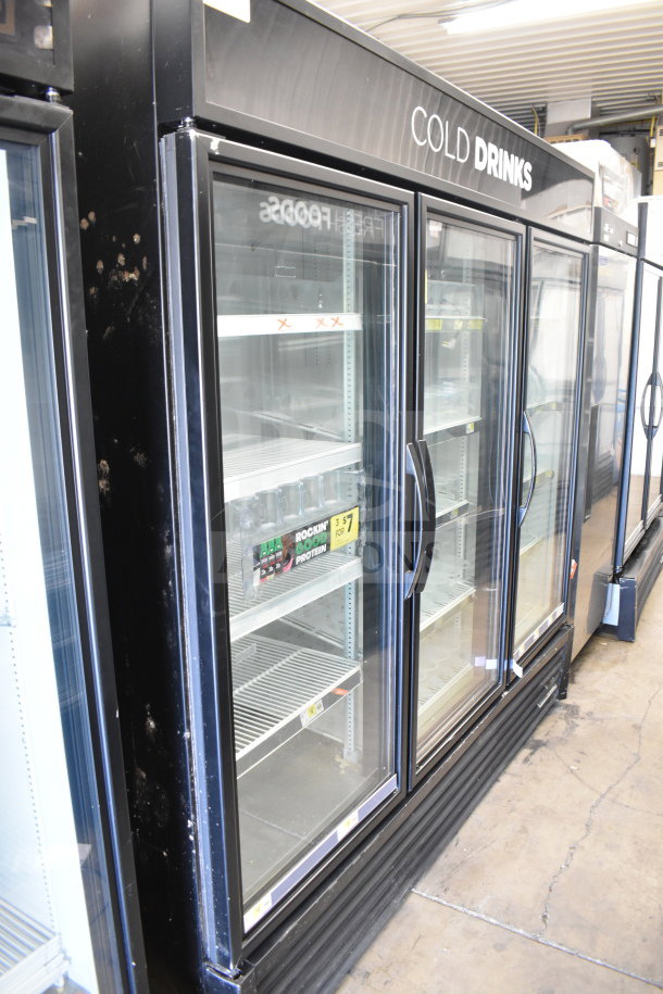 2017 True GDM-72-HC Commercial 3 Door Reach-In Cooler, 115 Volts, tested and working, glass doors, "Cold Drinks" labeled.