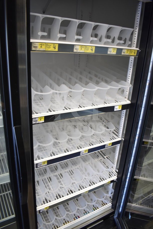 2017 True GDM-72-HC commercial cooler with three glass doors, white interior shelving, 115V, tested and working condition.