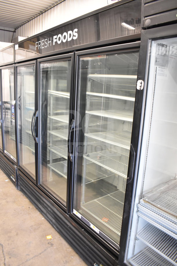 2017 True GDM-72-HC 3 door reach-in cooler merchandiser, 115V, tested, working, fresh foods sign, shelves visible.