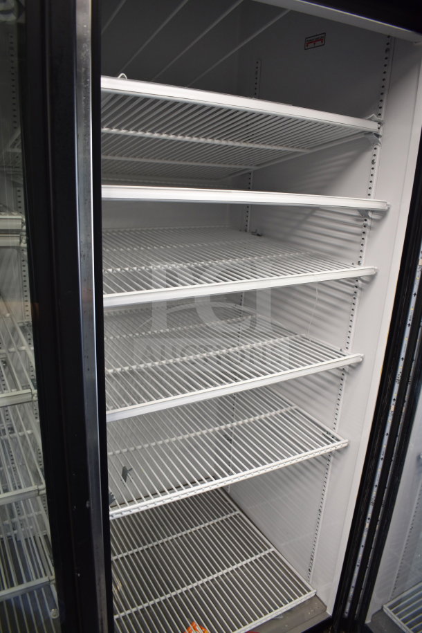 2017 True GDM-72-HC commercial 3-door cooler merchandiser, 115 volts, 1 phase, clean, tested, and working.