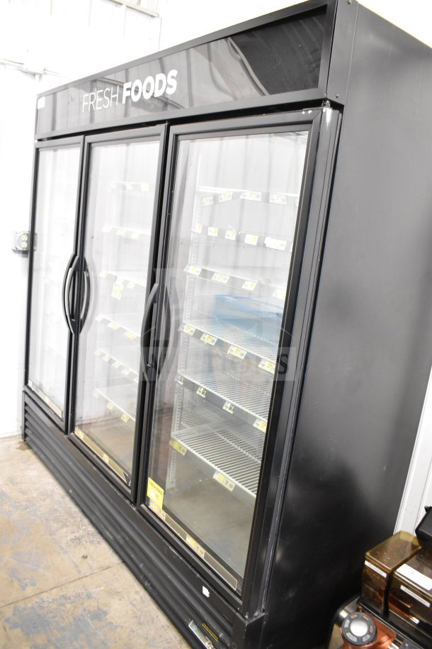 2018 True GDM-72-HC three-door cooler merchandiser. Tested, working, black exterior, glass doors, shelves, 115V, 1 phase.