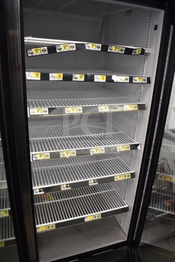 2018 True GDM-72-HC commercial 3-door cooler, 115V, 1 phase, tested and working, metal shelving with pricing labels.
