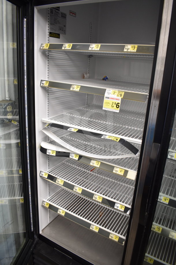 2018 True GDM-72-HC Commercial 3 Door Reach In Cooler, 115V, 1 Phase. Steel shelves, tested and working. Visible price tags.