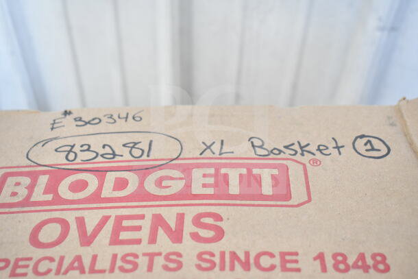 Cardboard box labeled "Blodgett Ovens" with handwritten notes: "E30346," "83281," and "XL Basket 1."