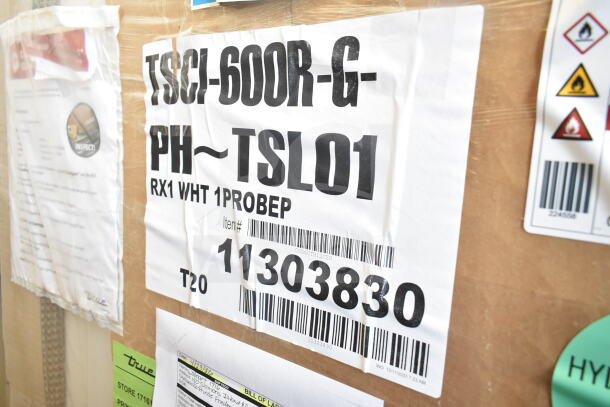 BRAND NEW True TSCI-600R-G-PH Commercial Cooler, single door reach-in, 110-120V, 1 phase, scratch and dent condition. Tags show model details.