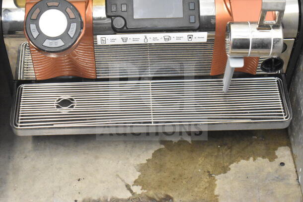 Thermoplan Mastrena stainless steel espresso machine with LCD display, hoppers, steam wand in good condition, 208V, 1 phase.
