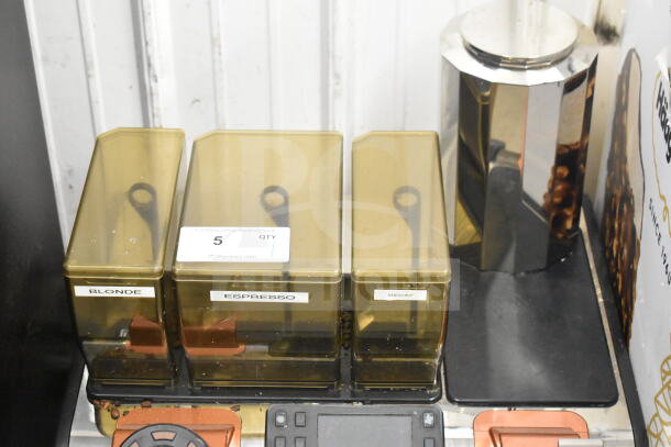 Thermoplan Mastrena espresso machine with stainless steel finish, LCD, hoppers labeled "Blonde," "Espresso," "Decaf," and steam wand.
