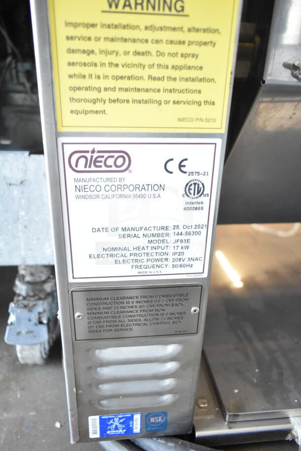 2021 Nieco JF93E electric conveyor charbroiled burger grill. Features 208V, 3 Phase. Visible warning and manufacturing labels.