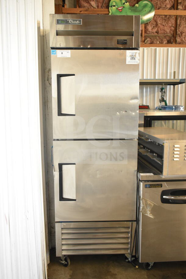 Brand new True T-23-2-HC cooler, 2021 model, with two half doors, commercial casters, 115V, visible scratches and dents.