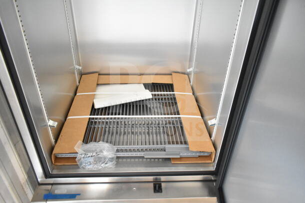 Brand new 2021 True T-23-2-HC commercial cooler, two half-size doors, on casters. Includes shelves, 115V, 1 phase.