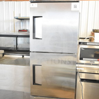 BRAND NEW 2021 True T-23F-2-HC-MC commercial freezer, 2 half-size doors, on casters, 115V, visible tags, stainless steel.