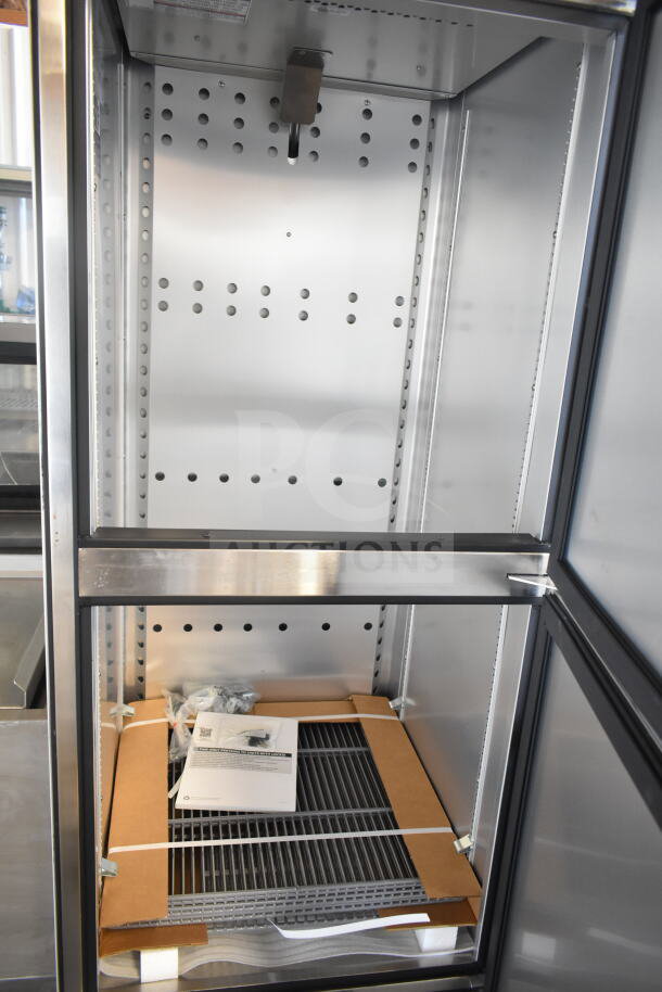Brand new True T-23F-2-HC-MC freezer, 2 half doors, commercial casters, 115V, includes shelves and manual, scratch and dent condition.