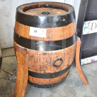 Wooden barrel with metal bands and two detached wooden supports. Auction tag marked "20" indicates item number.