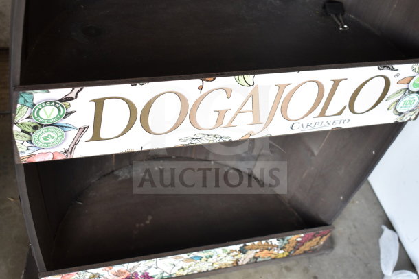 Half Barrel Shelving Unit with "Dogajolo Carpineto" label. Features vegan-friendly and carbon-neutral symbols. Good condition.