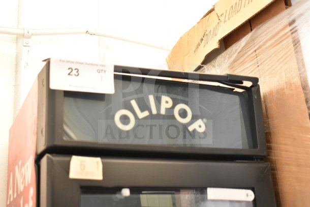 IDW G-11-C33EB commercial cooler, single door, 115 volts, branded "OLIPOP," auction tag visible.